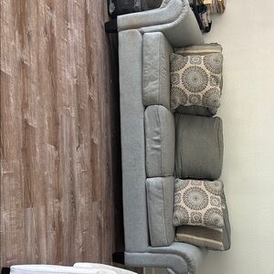 Elegant Gray Sofa with Patterned Cushions